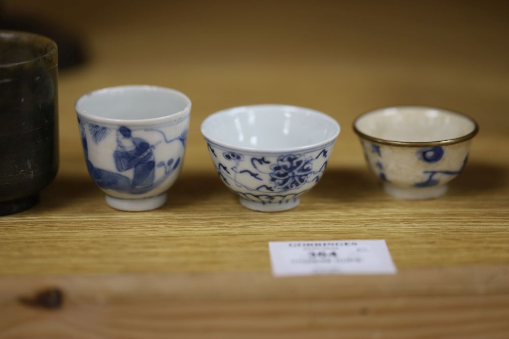 A group of Chinese cups, four ceramics, one jade and some have marks